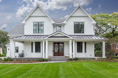 white house black shutters metal roof|black stucco white house.